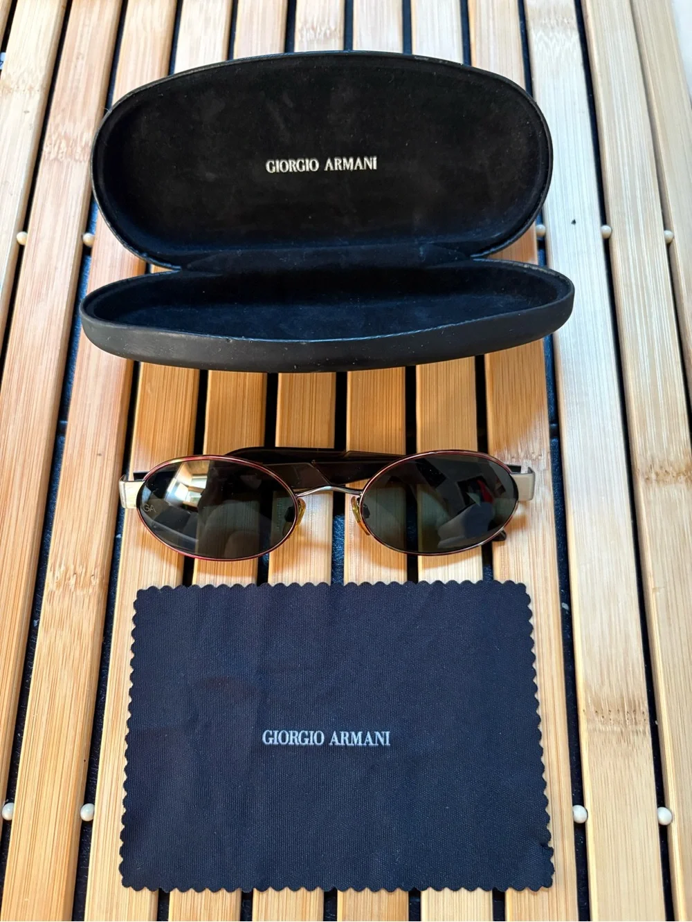 Giorgio Armani Oval Sunglasses with tortoise like front frame and metal sides